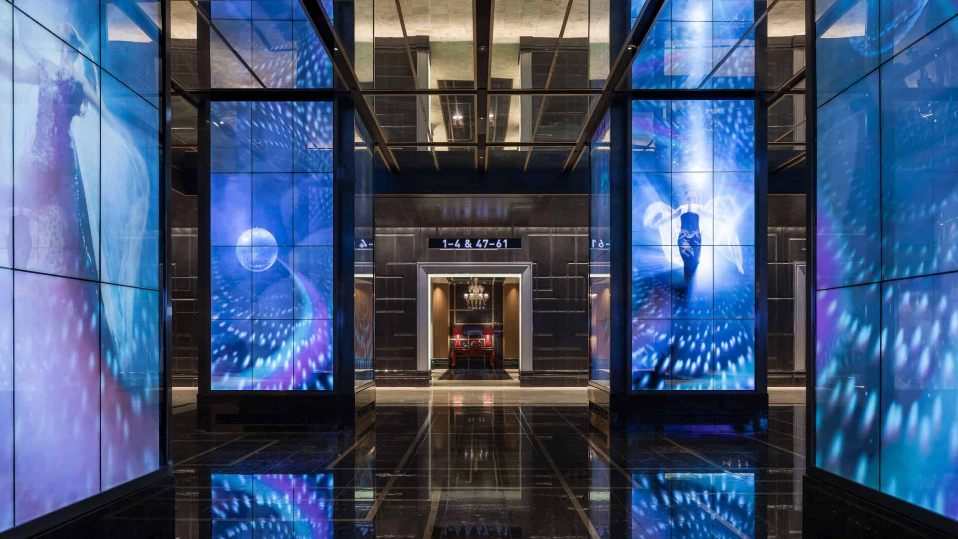 Interior view of The Cosmopolitan lobby with blue-toned underwater imagery across multiple digital columns, part of Opulence, by Float4.