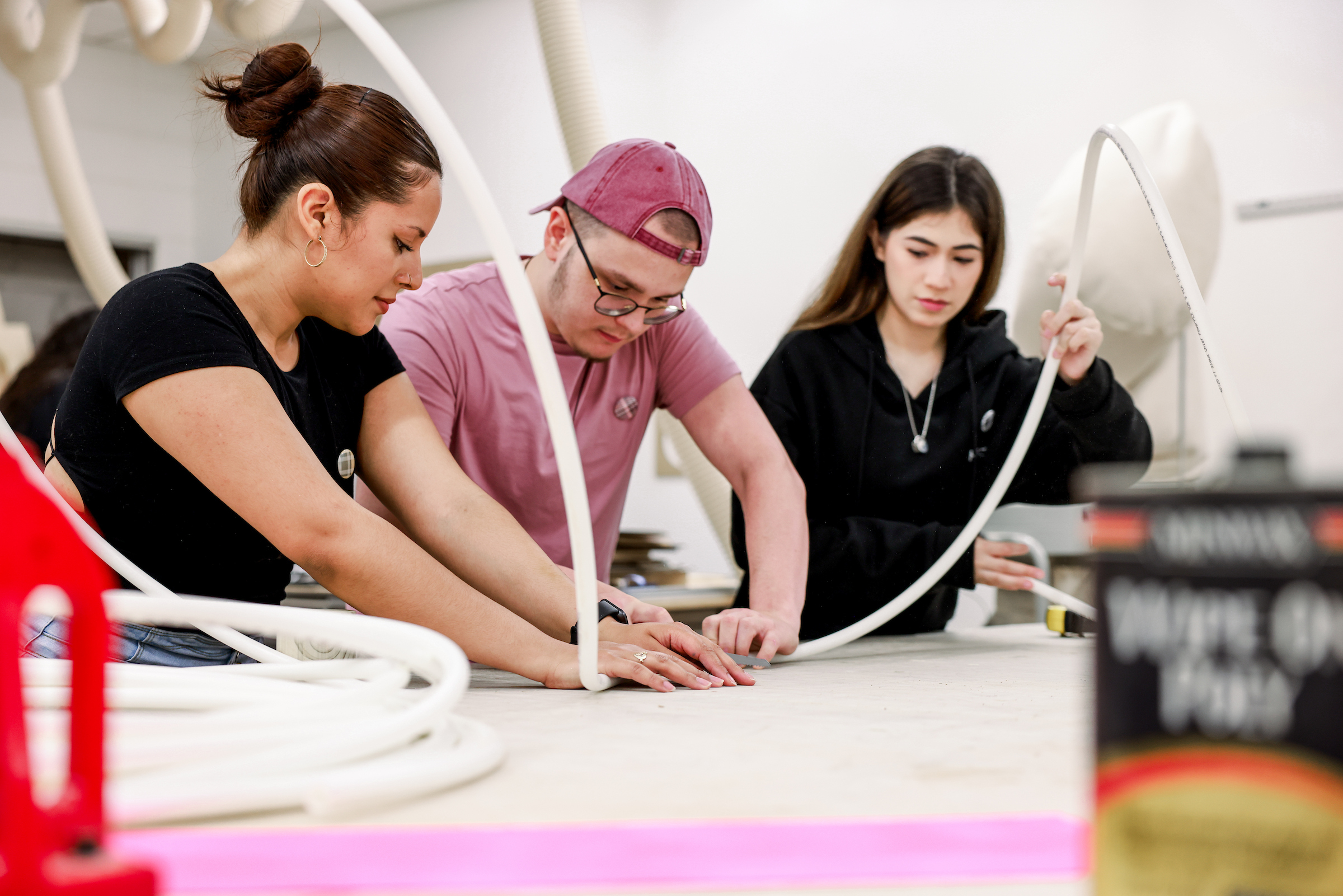 Students in Dunwoody College of Technology’s Experiential Graphic Design Degree program collaborate on a hands-on fabrication project in a design studio.