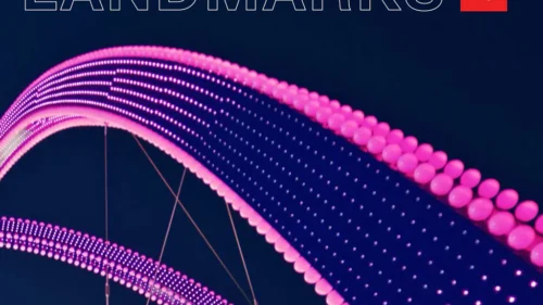 Cover of the Selbert Perkins Design LANDMARKS book showing illuminated pink landmark arches against a dark background.